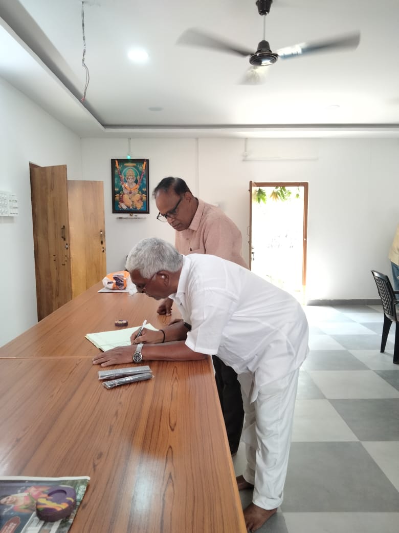 Members of association signing in Visiteors book.jpeg